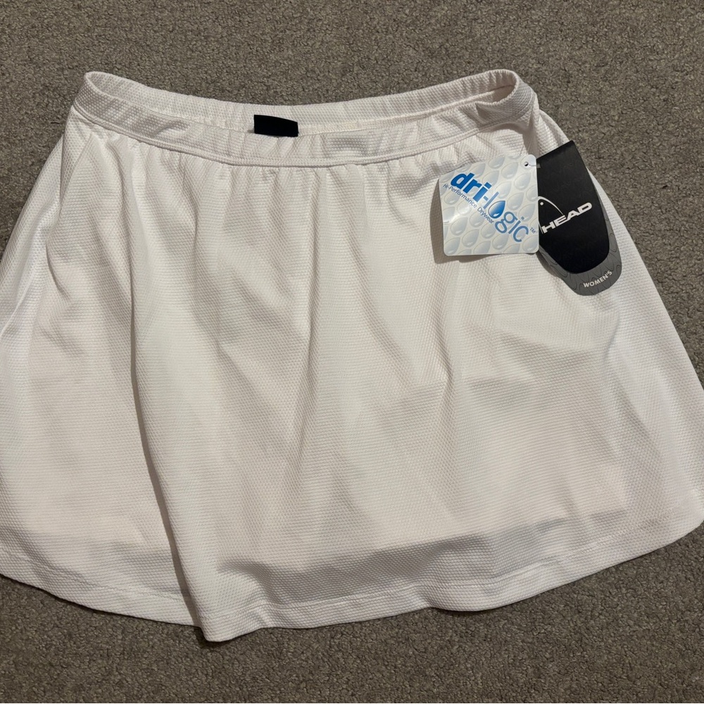 NWT Head Women's large white tennis skort featuring Dri-Fit